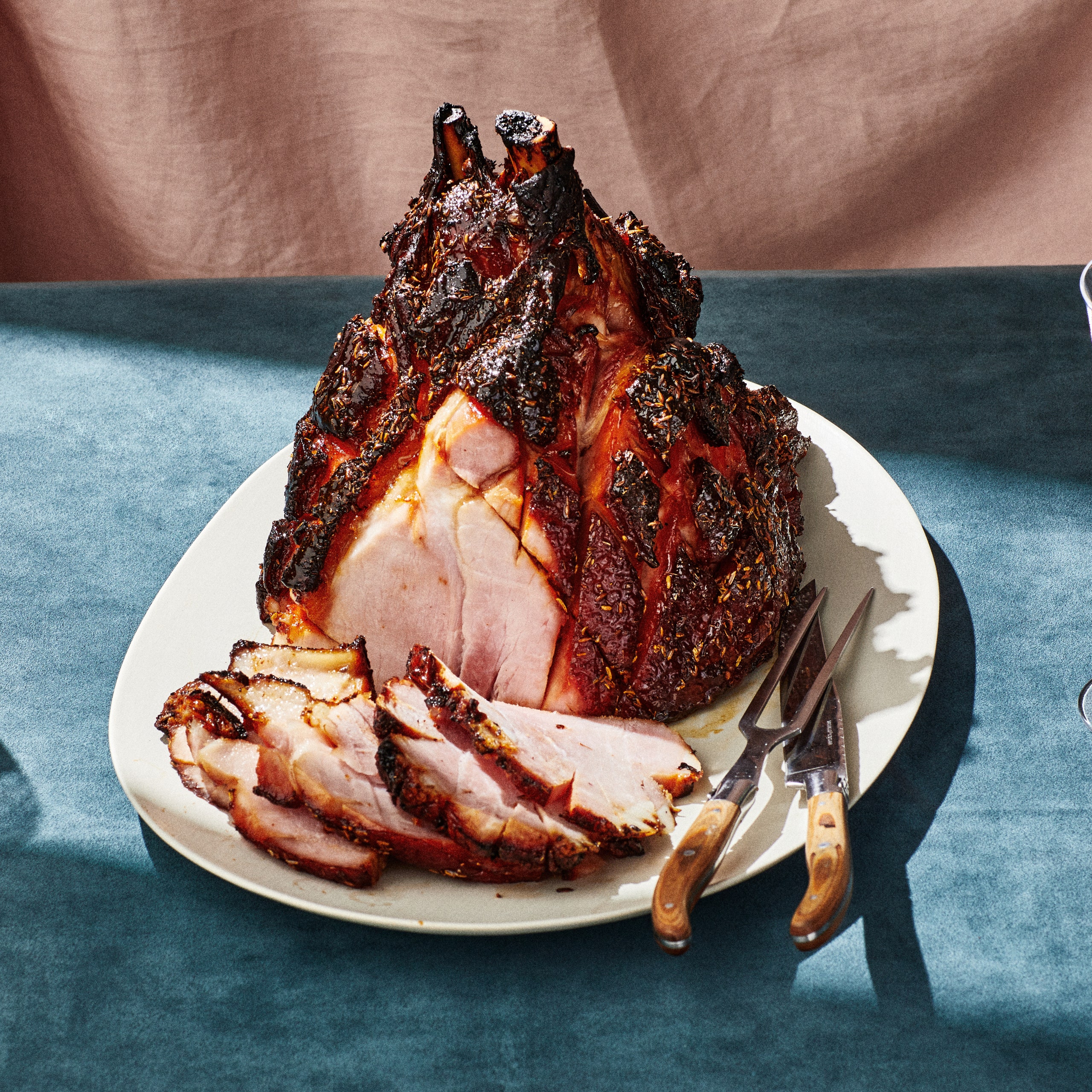 Ham With BrownSugarGlaze carved and served on a plate